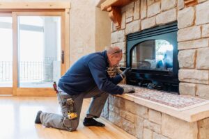 electrician repairing a fireplace