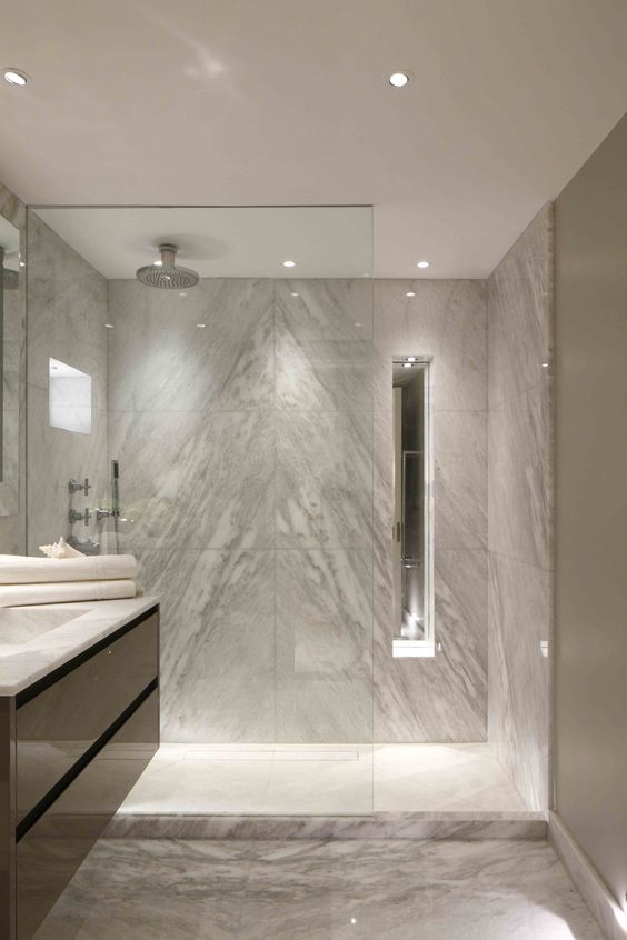 modern bathroom with can lights and shower lighting