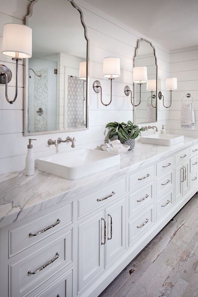 Shiplap bathroom with sconce lighting